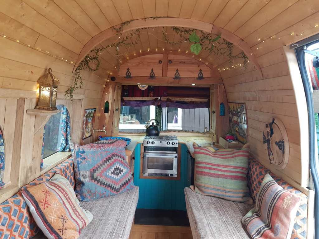 Beautiful hand built campervan with curved ceiling.